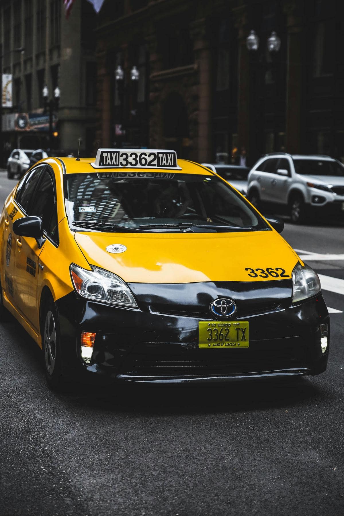 A group of people inside a cab, smiling and enjoying the ride